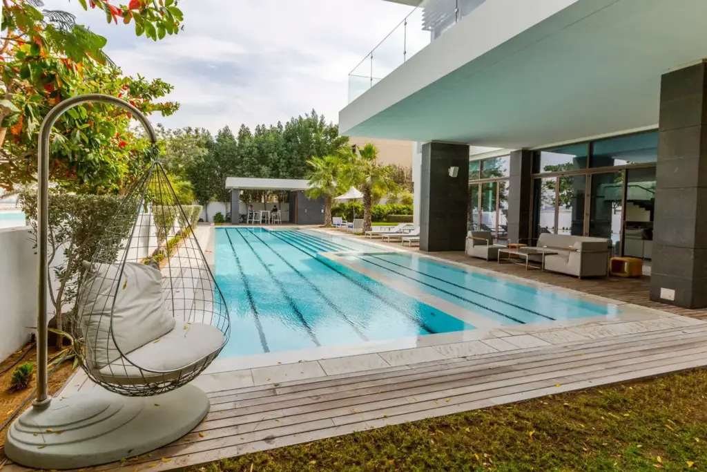 Covered villa terrace beside a private pool